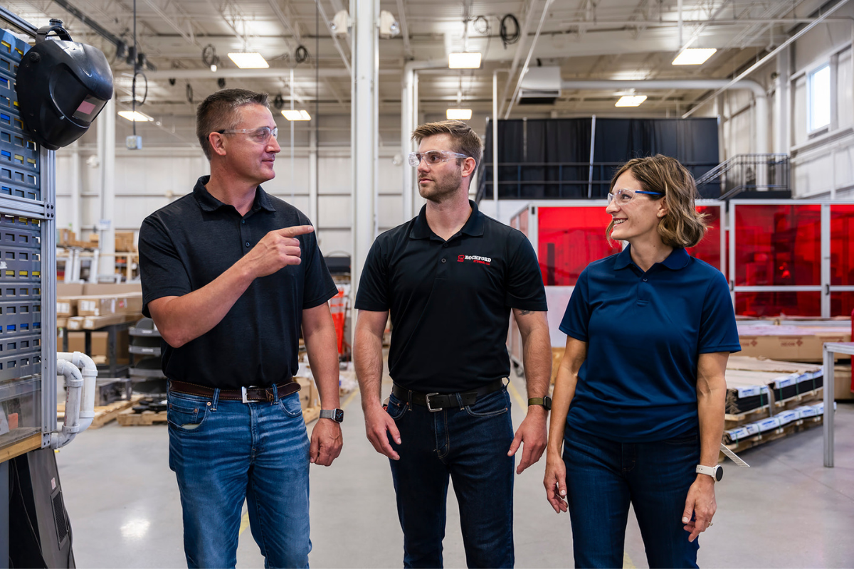 Management talking with employees about LOTO safety procedures