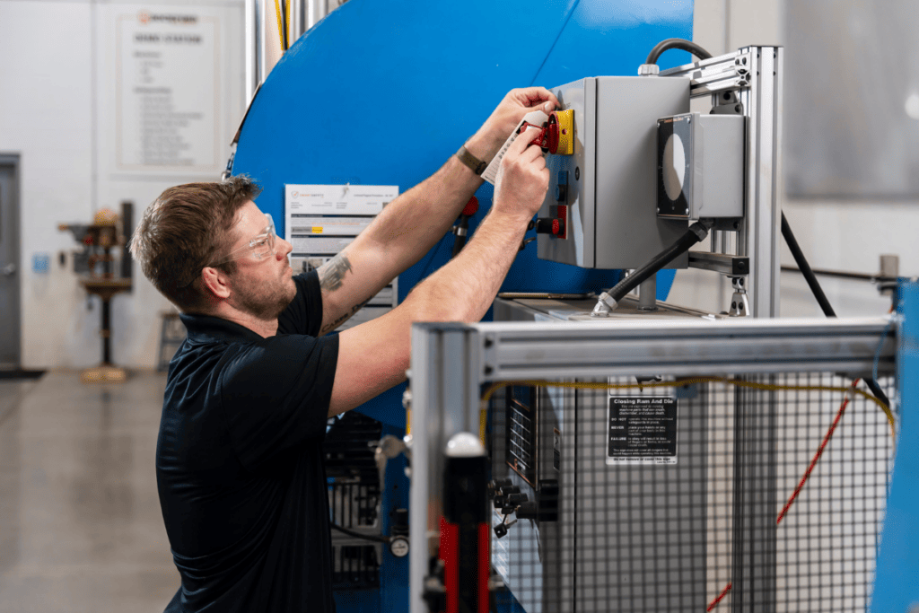 Man Performing Lockout Tagout Procedures On a Machine